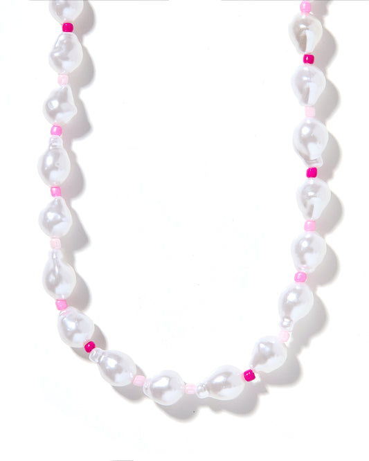 A necklace with white pearls and pink beads, strung together on a string.