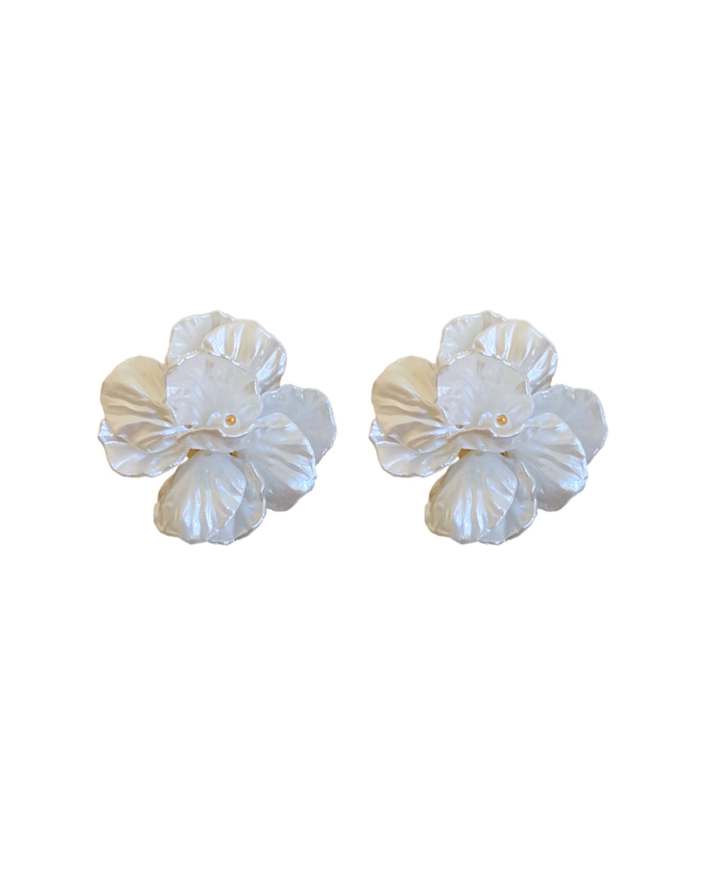 Pair of white floral earrings on a white background