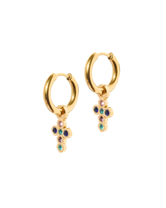 A pair of gold-colored huggie charm earrings with a cross pendant adorned with multi-colored CZ stones.
