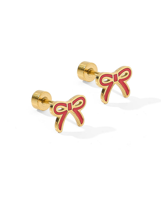 Gold earrings with red bow design on a white background