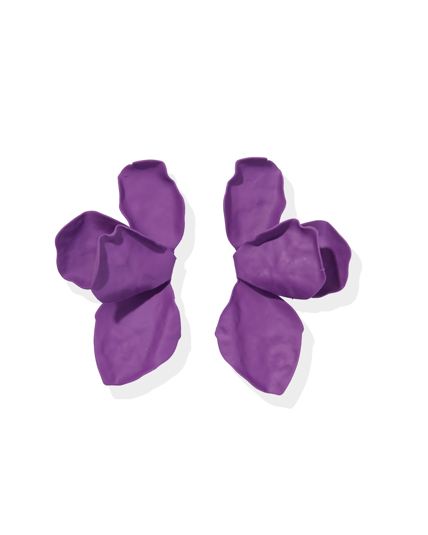 Pair of purple dog boots on a white background