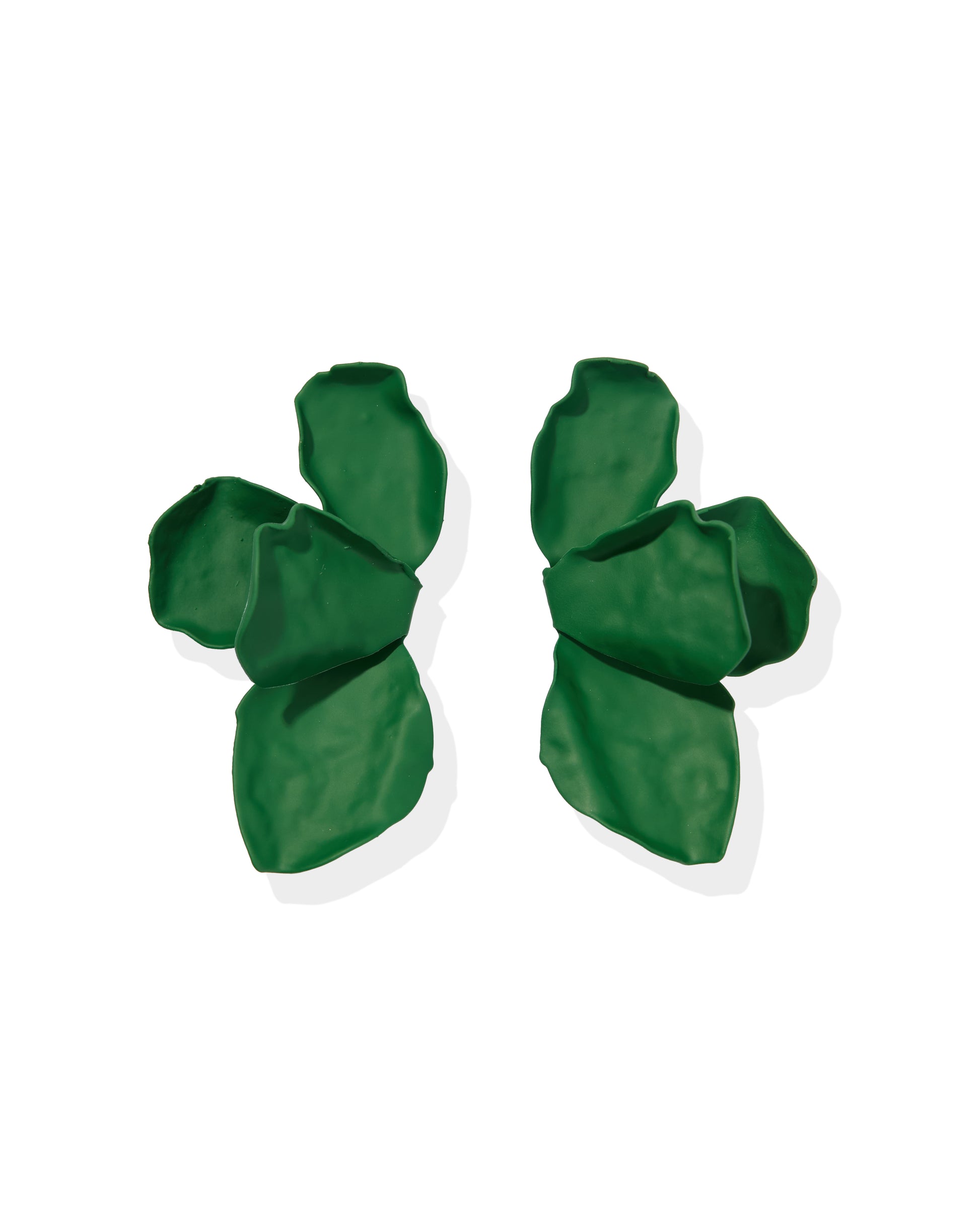 Pair of green earrings on a white background