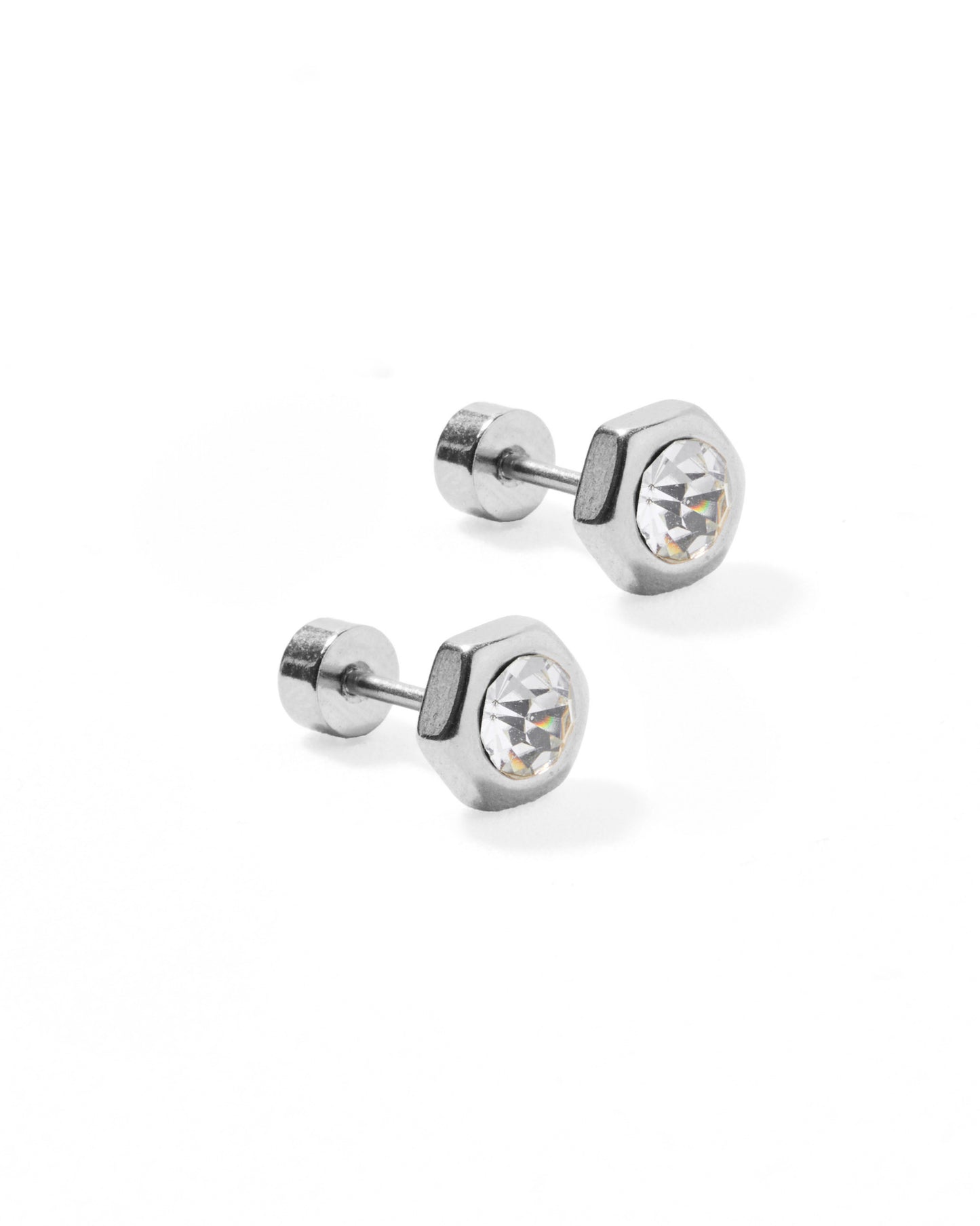Pair of silver stud earrings with clear gemstones on a white background