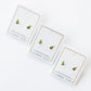 Three pairs of earrings on LINNY CO branded cards against a white background