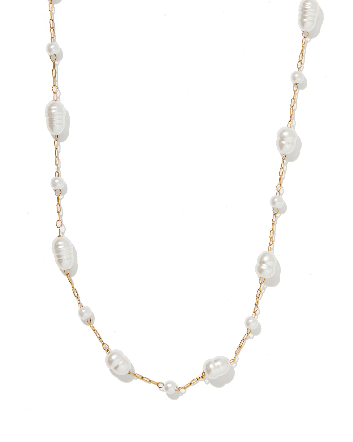 Pearl necklace with gold chain on a white background