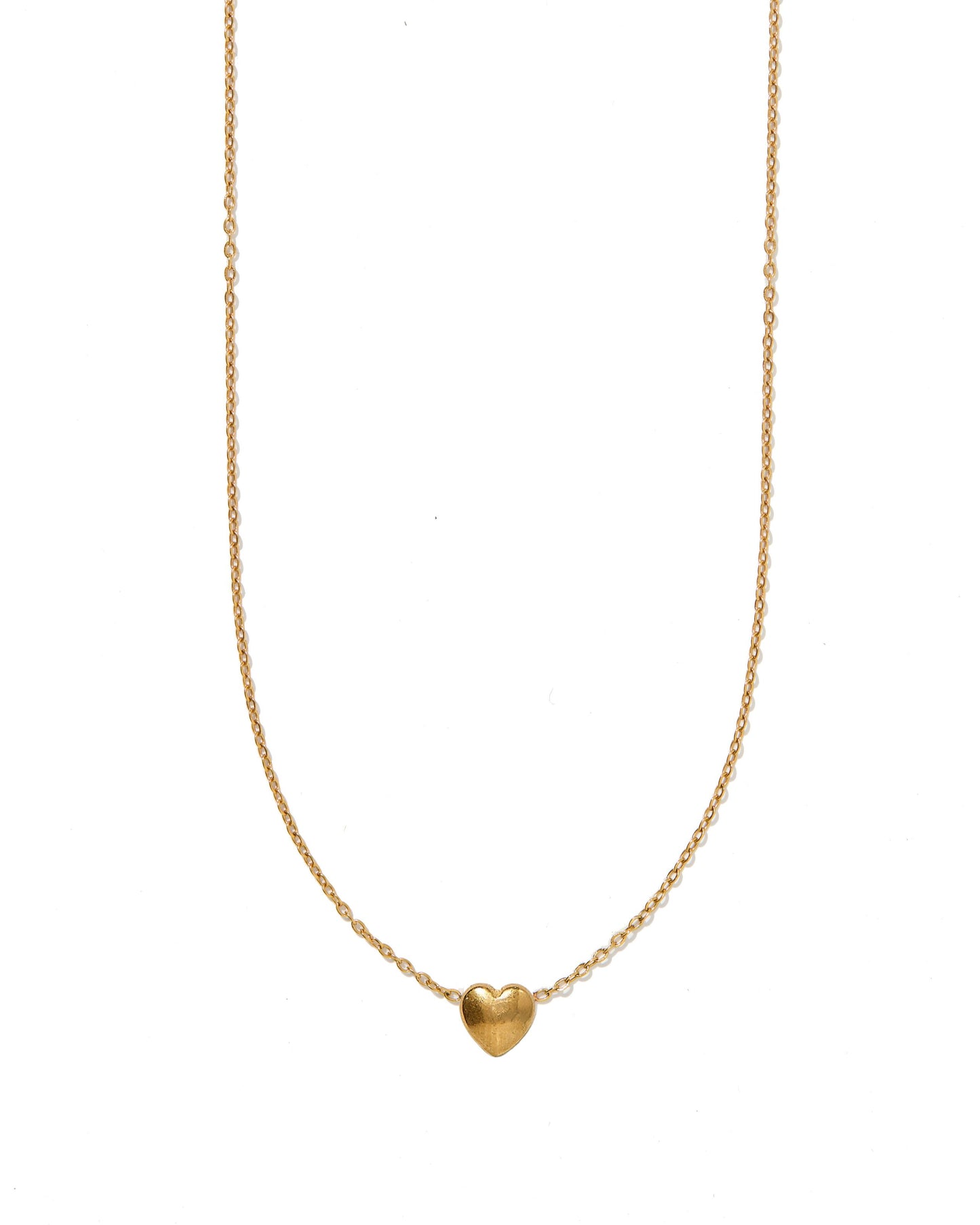 Gold heart-shaped pendant necklace on a white background
