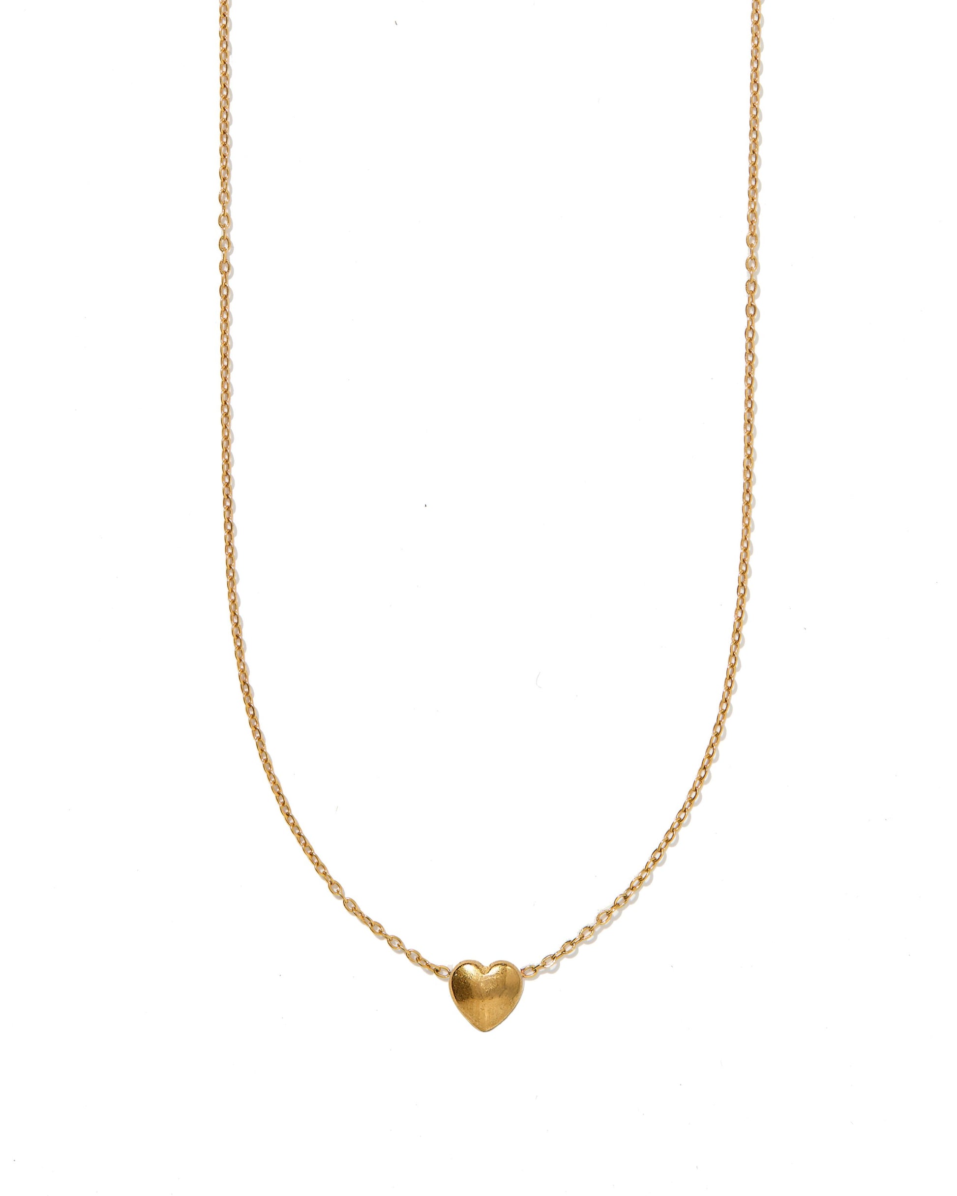 Gold heart-shaped pendant necklace on a white background