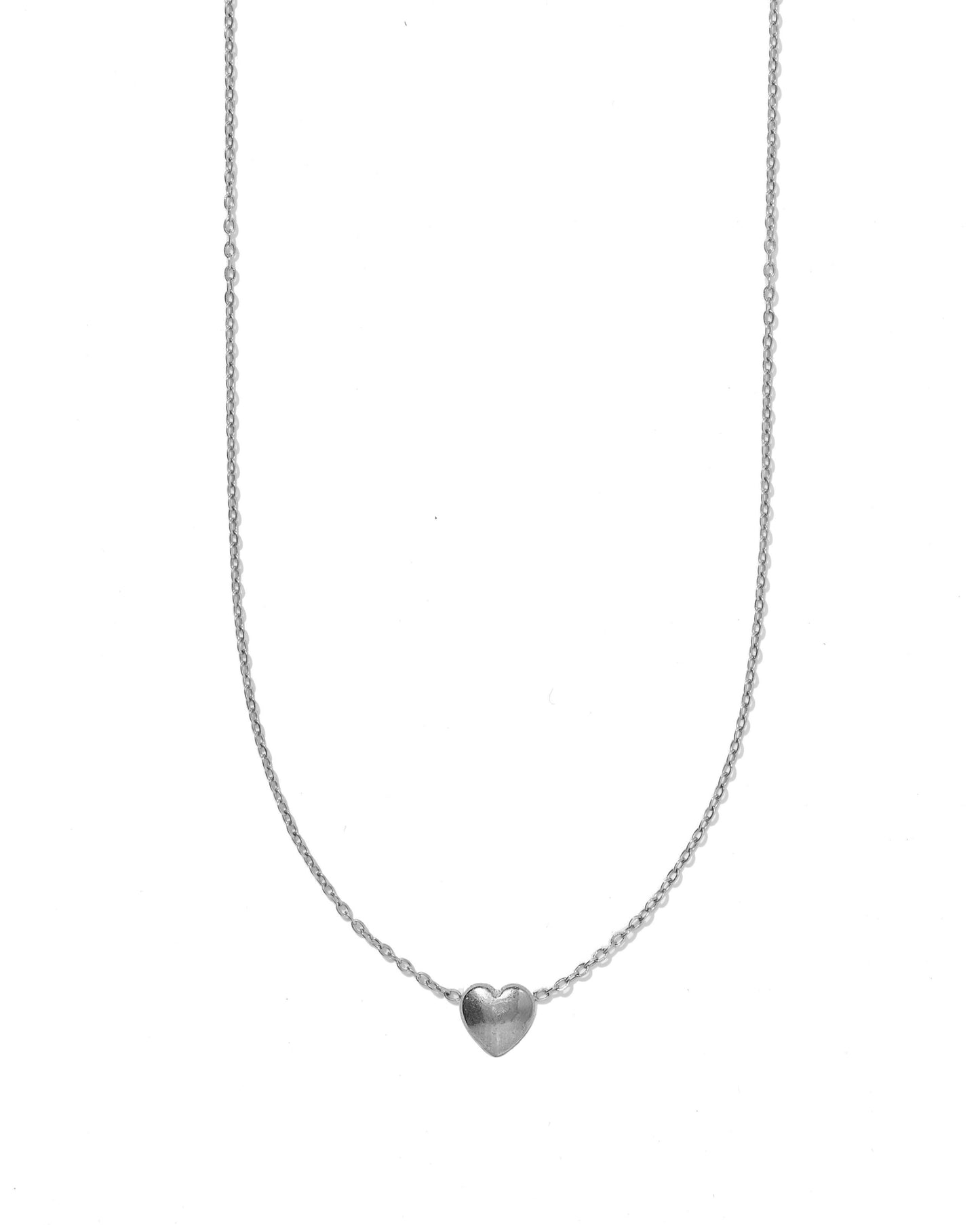 Silver heart-shaped pendant necklace on a white background