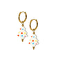Gold hoop earrings with white tree-shaped charms featuring colorful dots on a white background