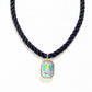 Navy braided necklace with a colorful pendant on a white background