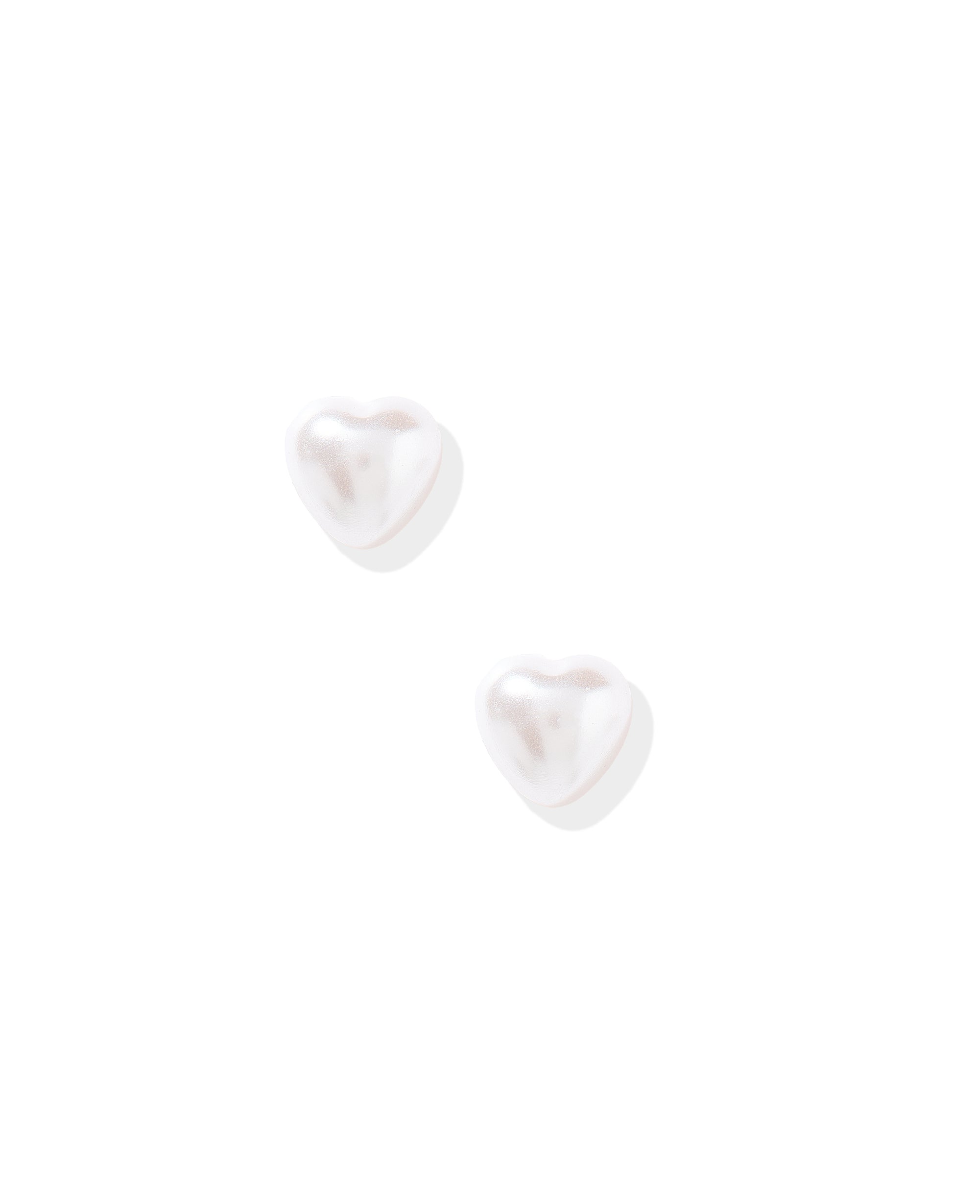 Pair of white heart-shaped earrings on a white background