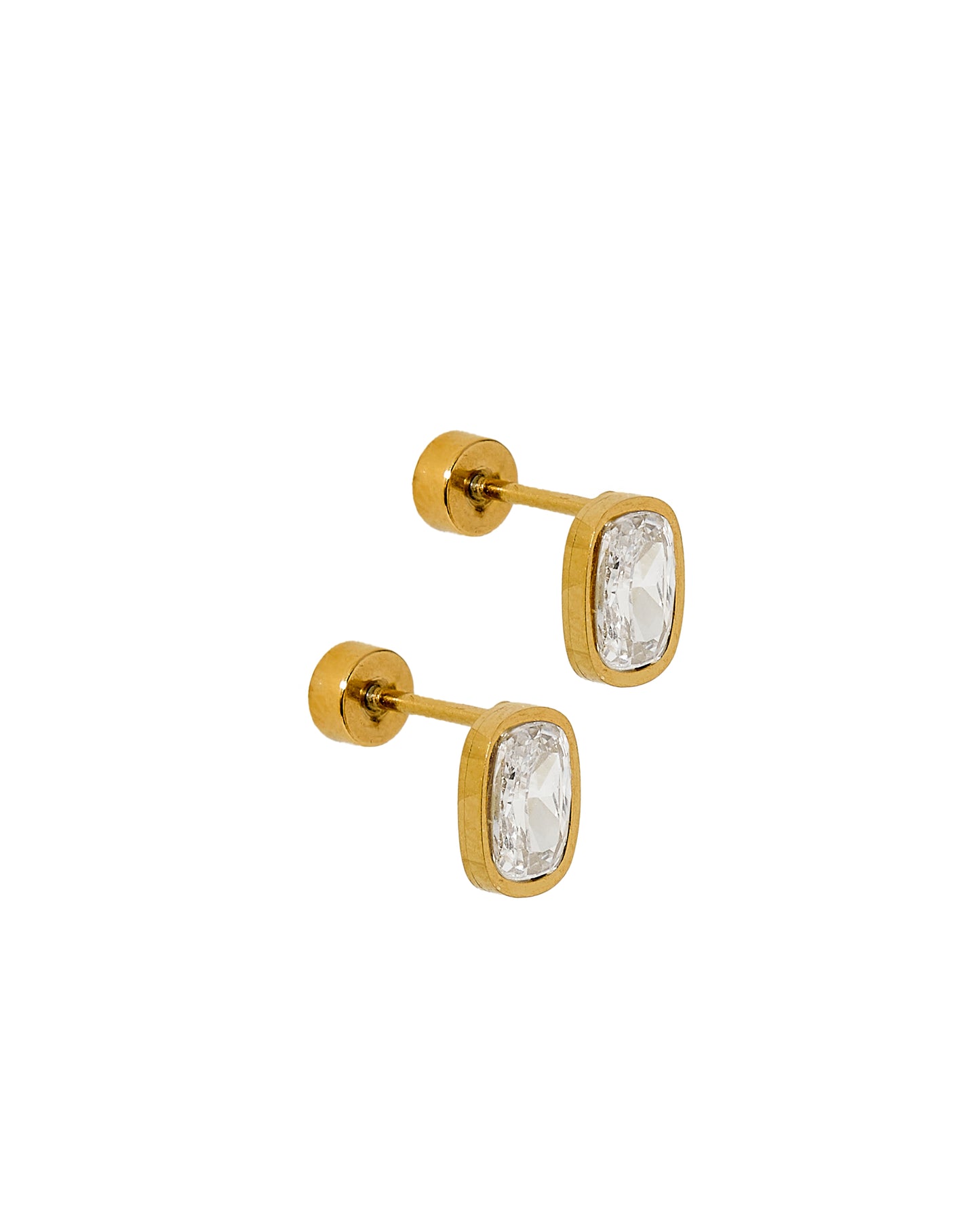 Gold earrings with clear gemstones on a white background
