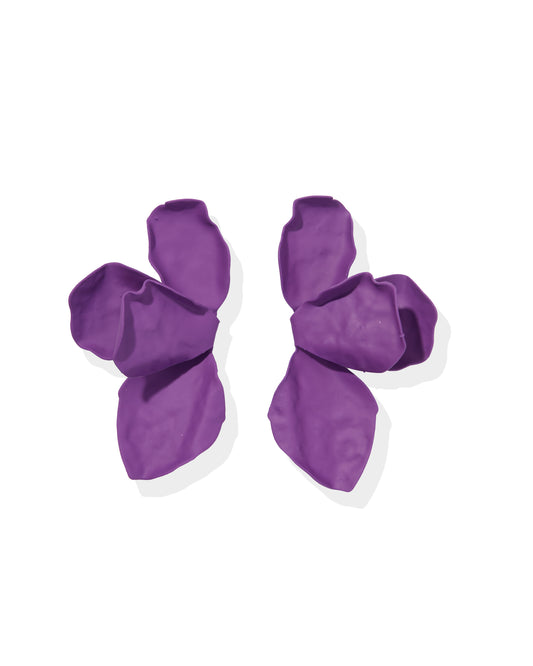 Pair of purple dog boots on a white background