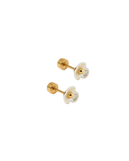 Pair of gold and white floral earrings on a white background