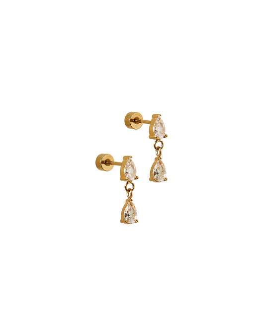 Gold earrings with clear gemstones on a white background