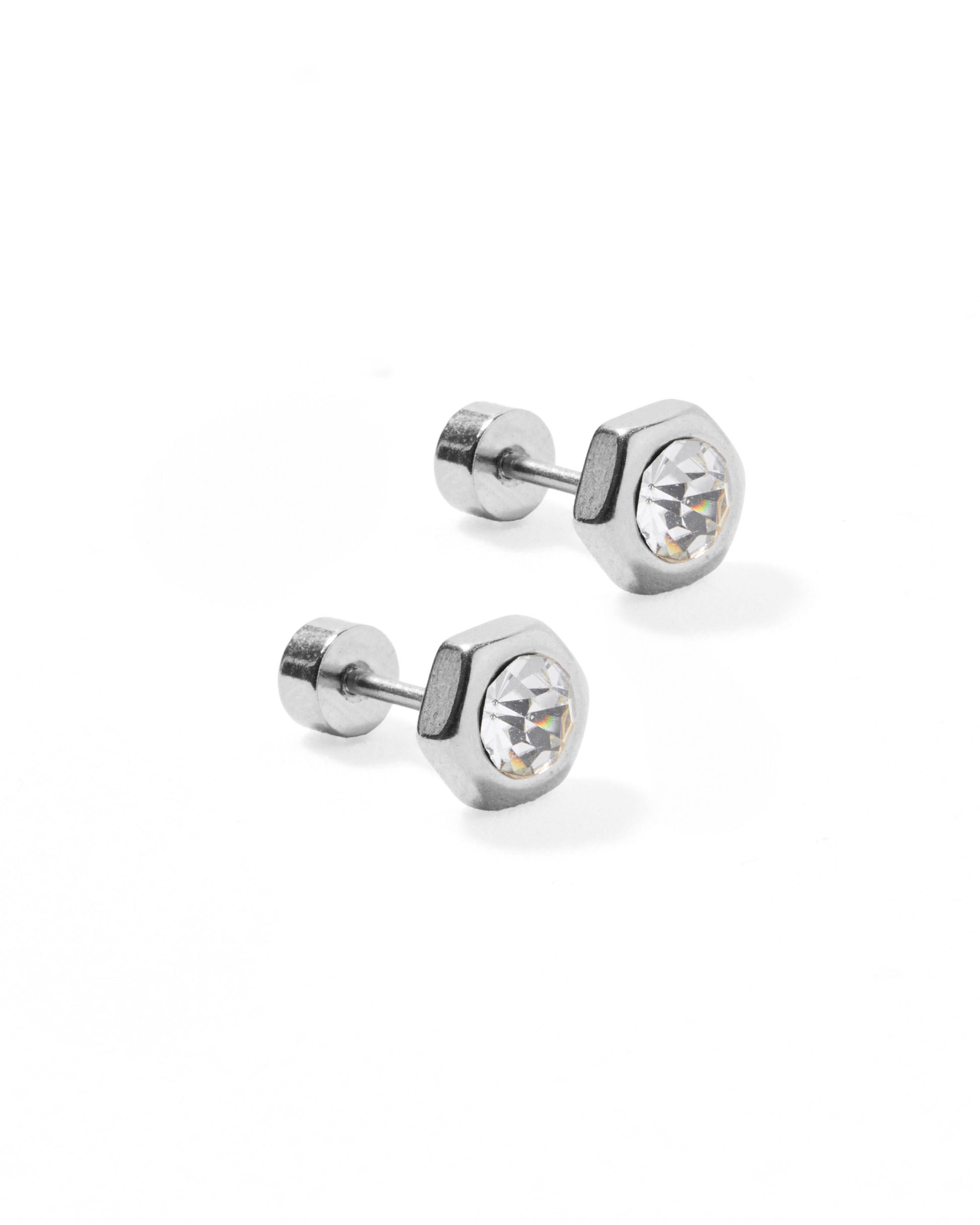 Pair of silver stud earrings with clear gemstones on a white background