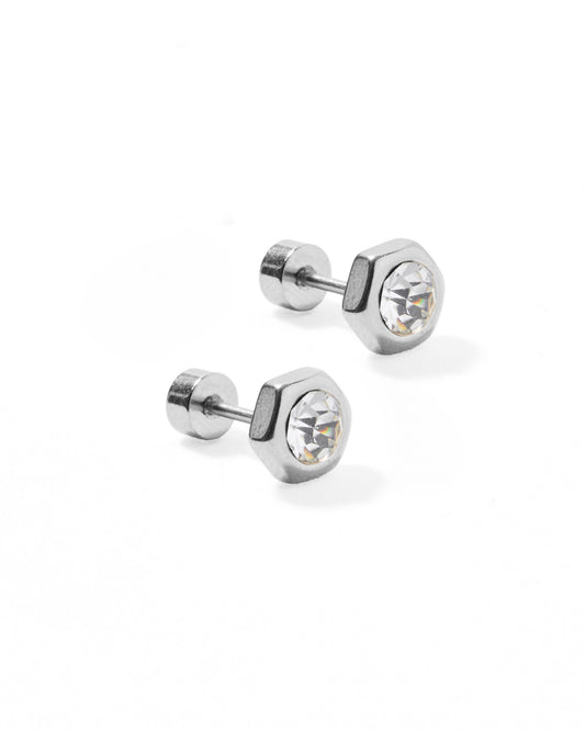 Pair of silver stud earrings with clear gemstones on a white background