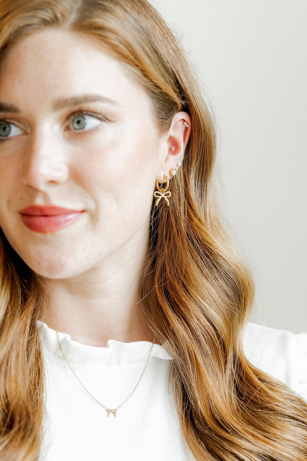 Huggie Charm Earrings - Sadie Bow Gold - LINNY CO WholesaleMetals