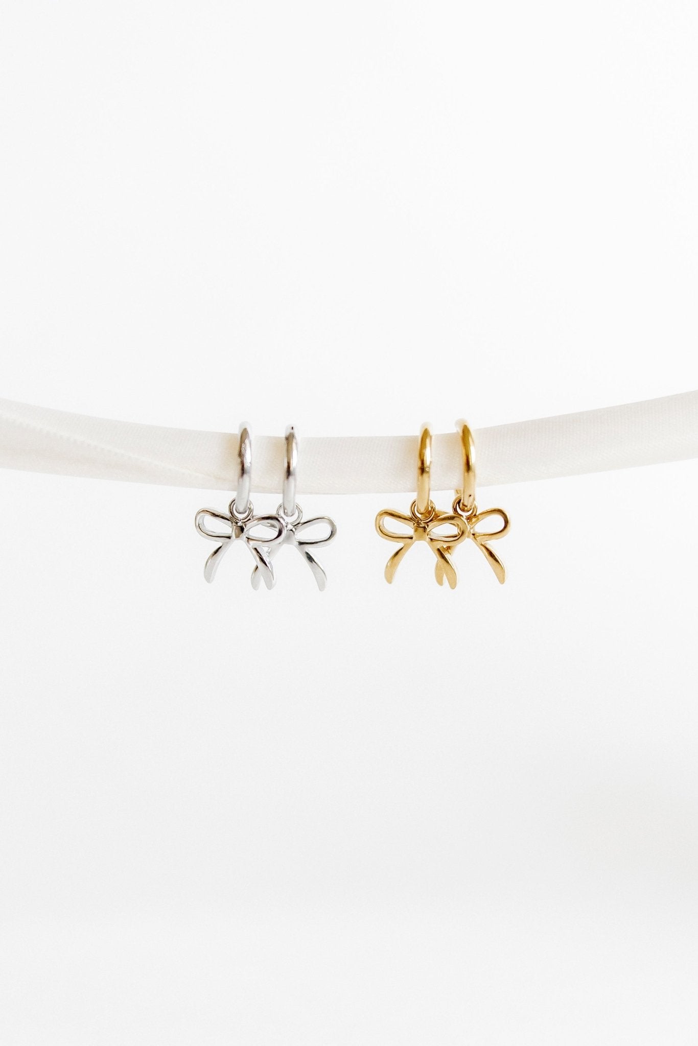 Huggie Charm Earrings - Sadie Bow Silver - LINNY CO WholesaleMetals