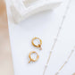 LINNY CO Celine Gold huggie earrings for kids & little girls — hypoallergenic, waterproof stainless steel, flat-lay styling.