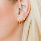 LINNY CO Celine Gold huggie earrings for kids & little girls — hypoallergenic, waterproof stainless steel, shown on model.