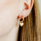 LINNY CO Dakota Heart huggie earrings for kids & little girls — hypoallergenic, waterproof stainless steel, shown on model.