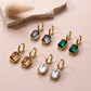 LINNY CO Diana Green huggie earrings for kids & little girls — hypoallergenic, waterproof stainless steel, flat-lay styling.