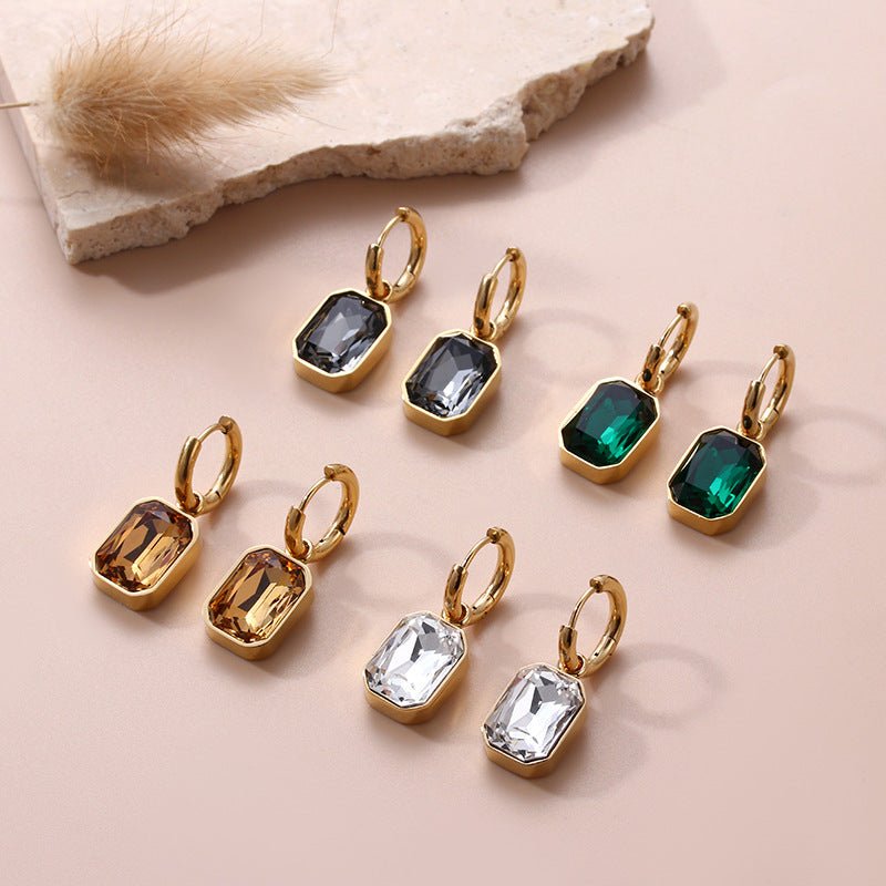 LINNY CO Diana Green huggie earrings for kids & little girls — hypoallergenic, waterproof stainless steel, flat-lay styling.
