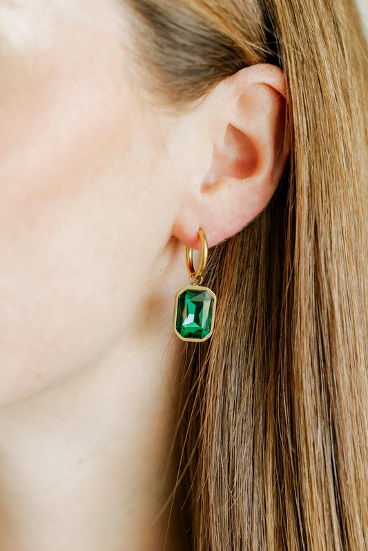 LINNY CO Diana Green huggie earrings for kids & little girls — hypoallergenic, waterproof stainless steel, shown on model.