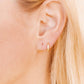 LINNY CO Scarlett Hoop Gold 8mm CZ huggie earrings for kids & little girls — hypoallergenic, waterproof stainless steel, shown on model.