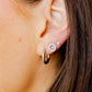LINNY CO Scarlett Hoop Silver 10mm huggie earrings for kids & little girls — hypoallergenic, waterproof stainless steel, shown on model.