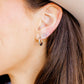 LINNY CO Scarlett Hoop Silver 14mm huggie earrings for kids & little girls — hypoallergenic, waterproof stainless steel, shown on model.