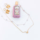 LINNY CO Bella Butterfly necklace for kids & little girls — hypoallergenic, waterproof stainless steel, flat-lay styling.