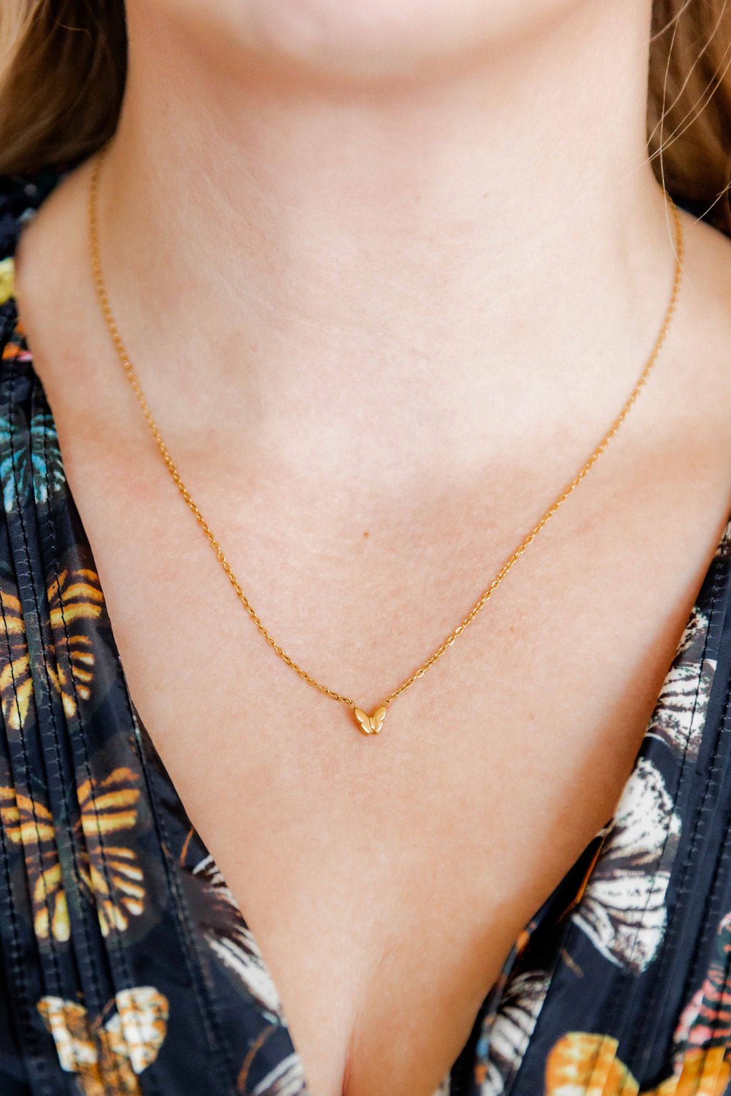 LINNY CO Bella Butterfly necklace for kids & little girls — hypoallergenic, waterproof stainless steel, shown on model.