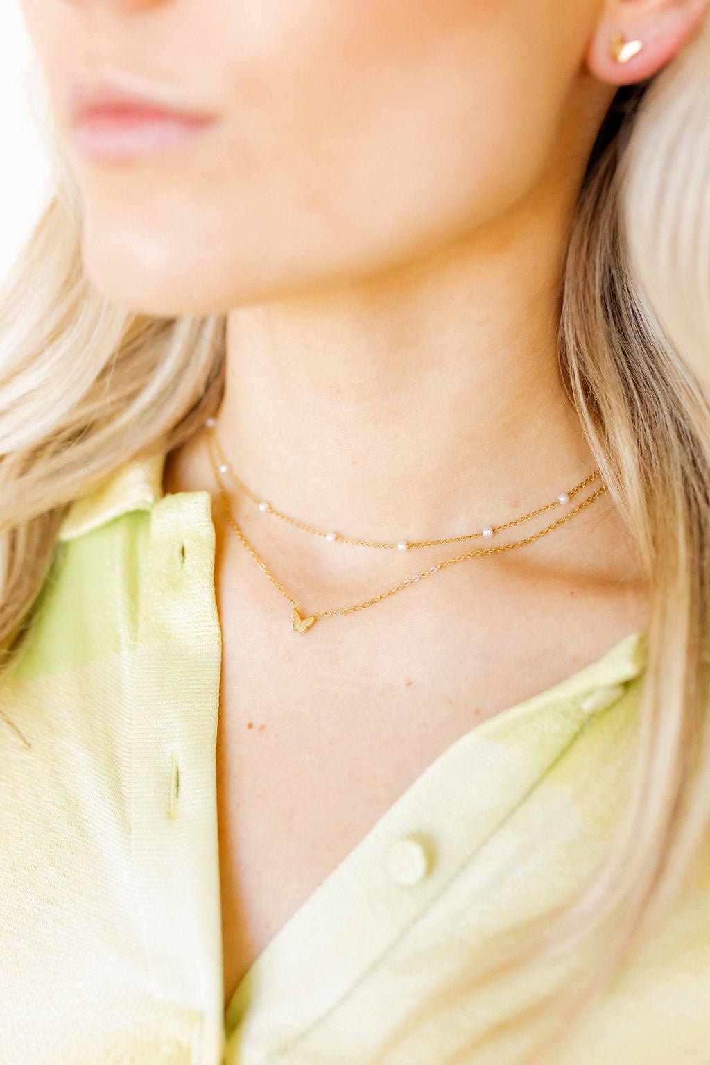 LINNY CO Bella Butterfly necklace for kids & little girls — hypoallergenic, waterproof stainless steel, shown on model.