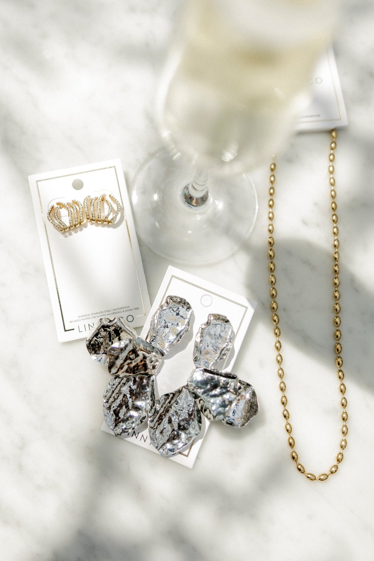 LINNY CO Brooke Gold necklace for kids & little girls — hypoallergenic, waterproof stainless steel, flat-lay styling.