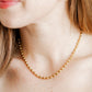 LINNY CO Brooke Gold necklace for kids & little girls — hypoallergenic, waterproof stainless steel, shown on model.