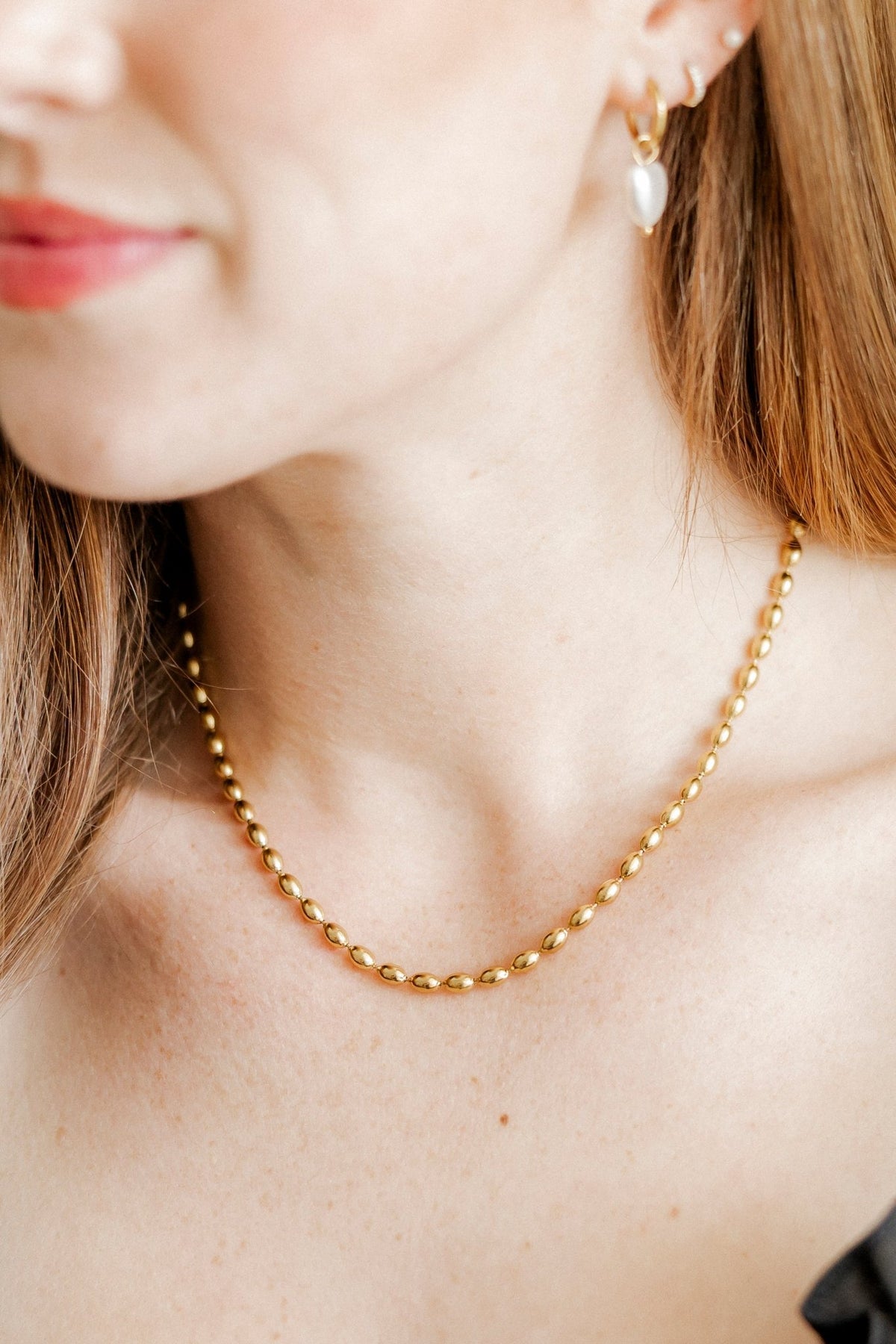 LINNY CO Brooke Gold necklace for kids & little girls — hypoallergenic, waterproof stainless steel, shown on model.