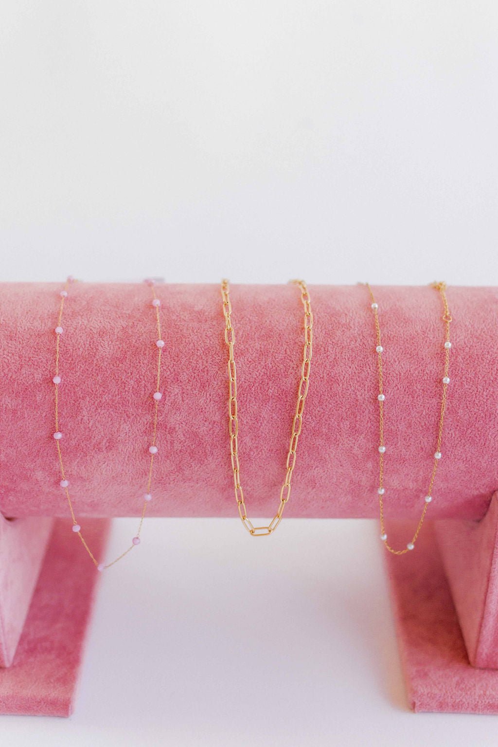 LINNY CO Dabney Pink necklace for kids & little girls — hypoallergenic, waterproof stainless steel, flat-lay styling.