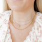 LINNY CO Dabney Pink necklace for kids & little girls — hypoallergenic, waterproof stainless steel, shown on model.