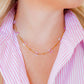 LINNY CO Gracie Flower Pink Multi necklace for kids & little girls — hypoallergenic, waterproof stainless steel, shown on model.