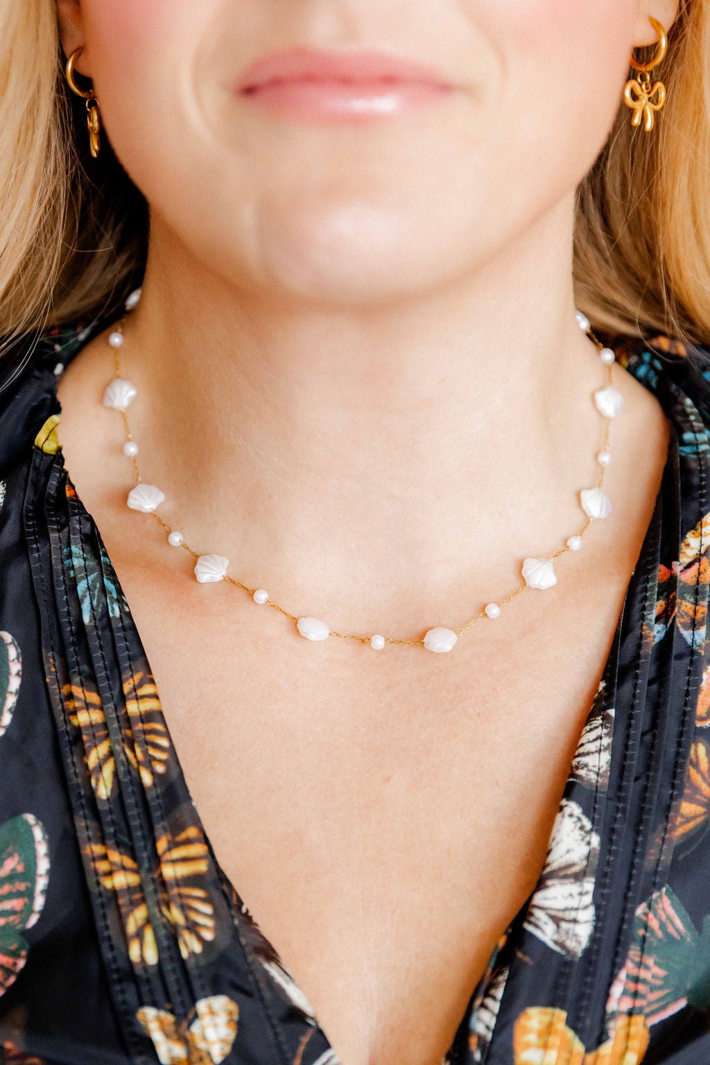 LINNY CO Kai Seashell Pearl necklace for kids & little girls — hypoallergenic, waterproof stainless steel, shown on model.