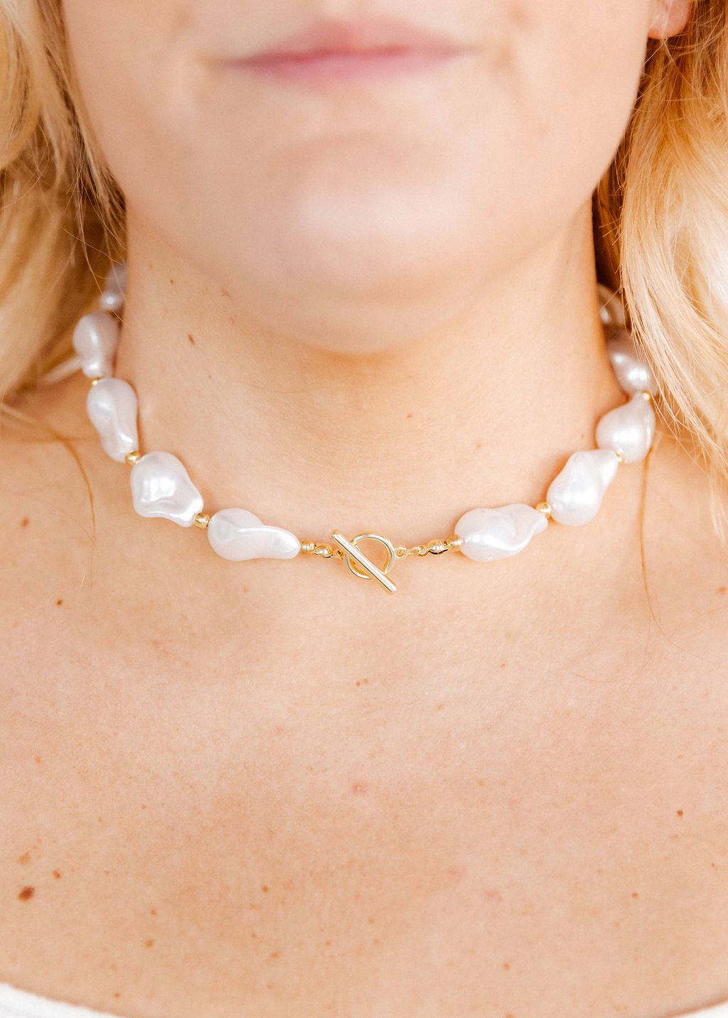 LINNY CO Lana Pearl Gold necklace for kids & little girls — hypoallergenic, waterproof stainless steel, shown on model.