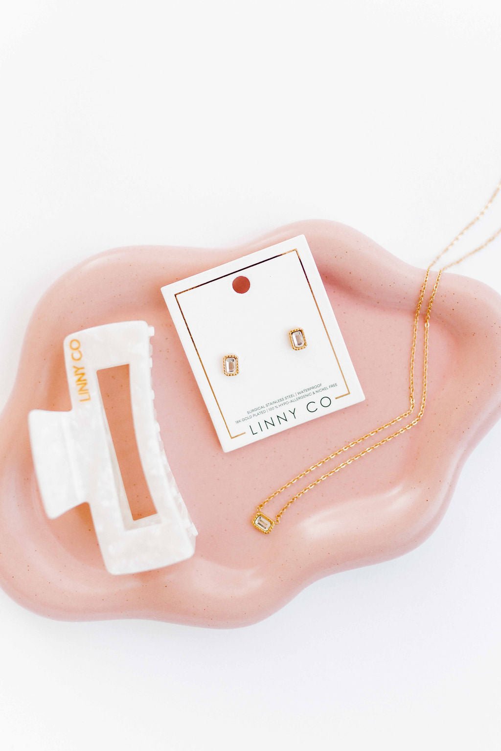 LINNY CO Madison necklace for kids & little girls — hypoallergenic, waterproof stainless steel, flat-lay styling.