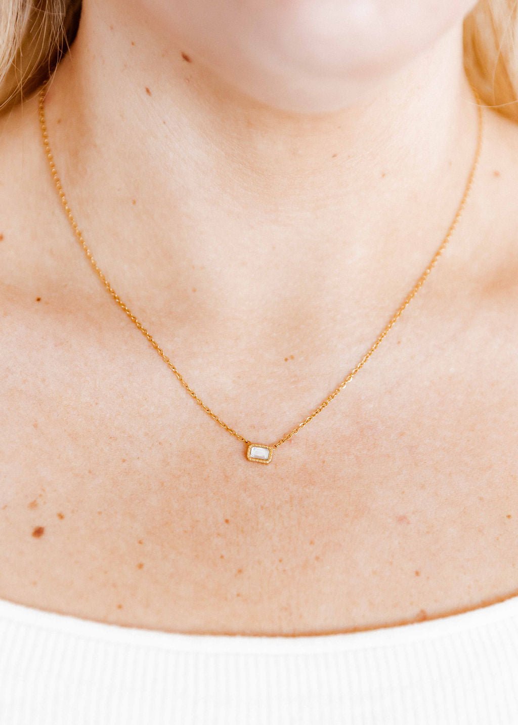 LINNY CO Madison necklace for kids & little girls — hypoallergenic, waterproof stainless steel, shown on model.