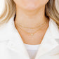 LINNY CO Madison necklace for kids & little girls — hypoallergenic, waterproof stainless steel, shown on model.