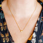 LINNY CO Marina Shell necklace for kids & little girls — hypoallergenic, waterproof stainless steel, shown on model.