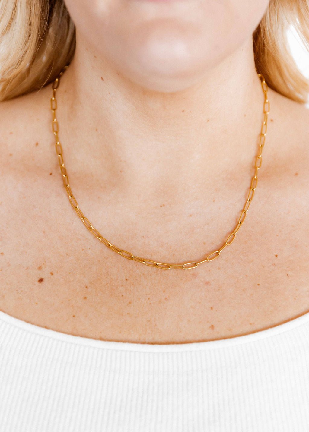 LINNY CO Palmer Paperclip Gold necklace for kids & little girls — hypoallergenic, waterproof stainless steel, shown on model.