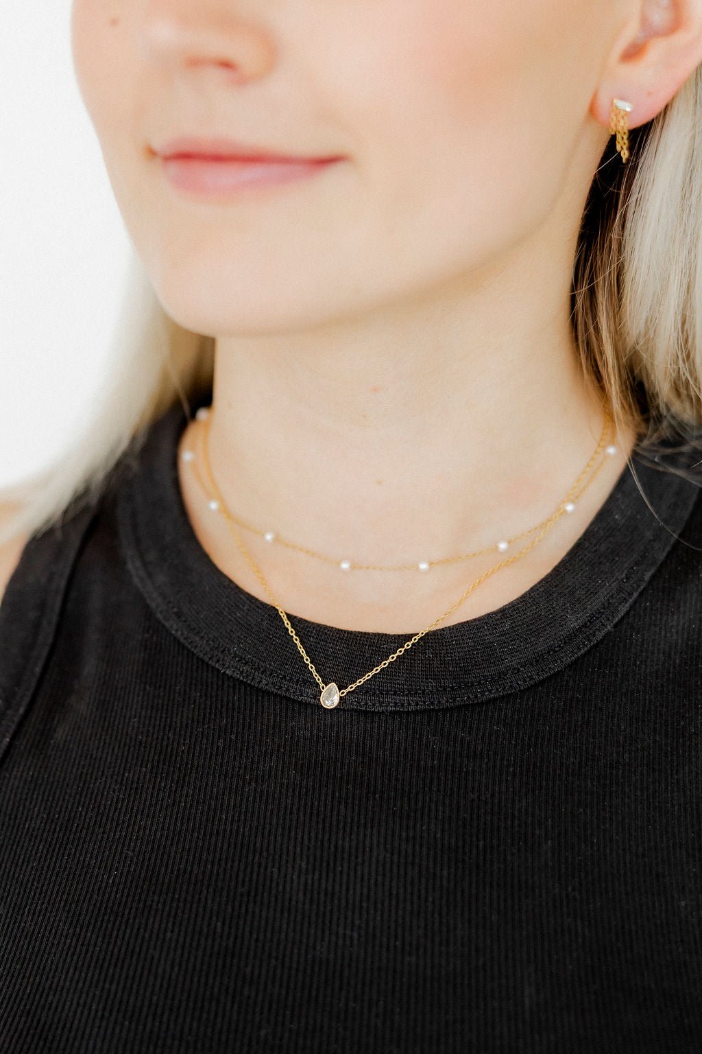 LINNY CO Paloma Pear Drop Gold necklace for kids & little girls — hypoallergenic, waterproof stainless steel, shown on model.