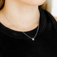 LINNY CO Paloma Pear Drop Silver necklace for kids & little girls — hypoallergenic, waterproof stainless steel, shown on model.